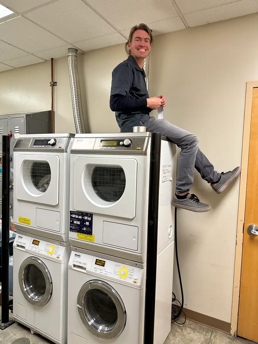 Technician servicing Miele dryers