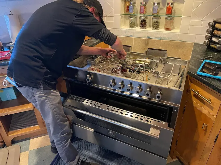 Just-in Time technician performing an appliance diagnosis