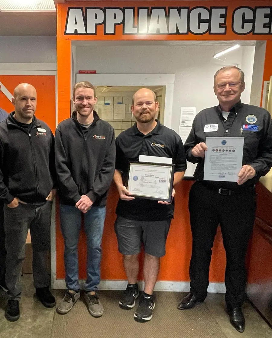 Justin Duby receiving USERRA Patriot Award in support of veteran employees