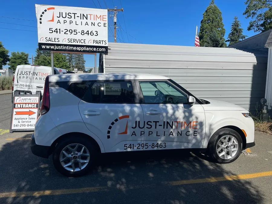 Just-in Time Appliance branded Kia Soul parked at the Grants Pass shop