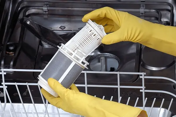 what causes a dishwasher to leak from the bottom