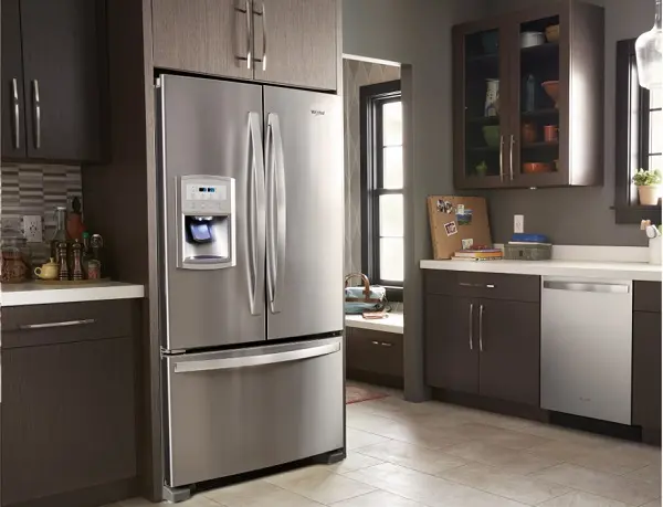 Freestanding stainless steel French-door refrigerator in a modern kitchen