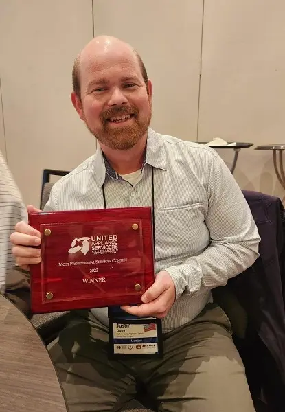 Just-in Time Appliance Repair team receiving the 2023 Most Professional Servicer award at ASTI