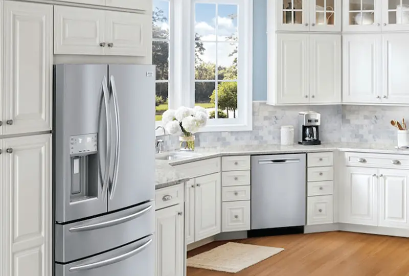 Electrolux refrigerator and dishwasher in a bright white kitchen