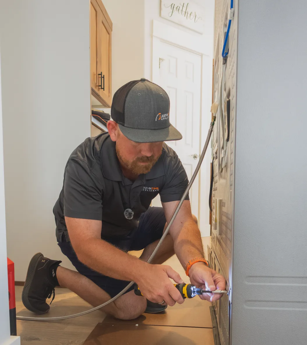 Justin performing an appliance repair
